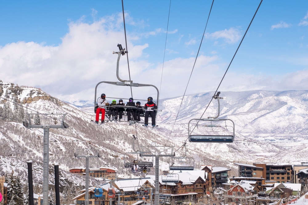 People,Riding,Ski,Chairlift.,View,From,Below.,Group,Of,People